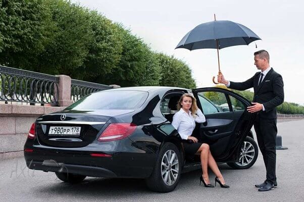 Luxury events transportation in St. Louis featuring a professional chauffeur and premium black car service for corporate arrivals and special occasions.